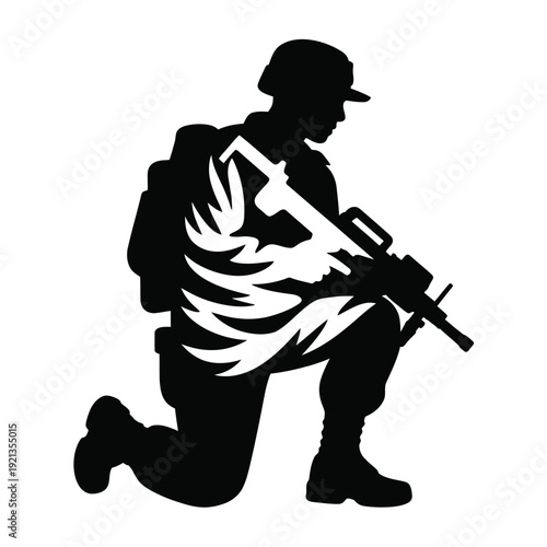 Silhouette of a kneeling soldier with rifle and fiery wings