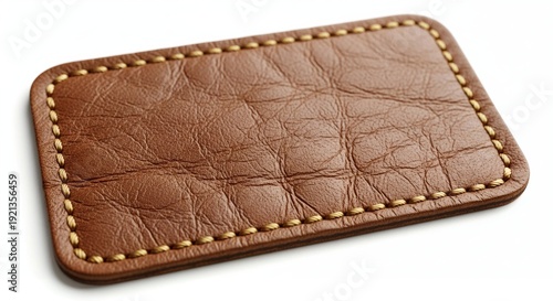 Brown leather wallet with stitching and natural texture close-up on white background for fashion and finance