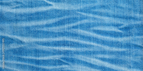 Blue denim fabric texture with worn pattern