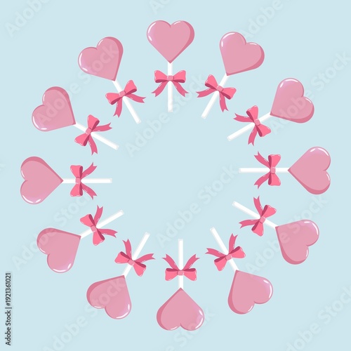 Circular wreath of pink heart-shaped lollipops with bows, evenly spaced on pastel blue background