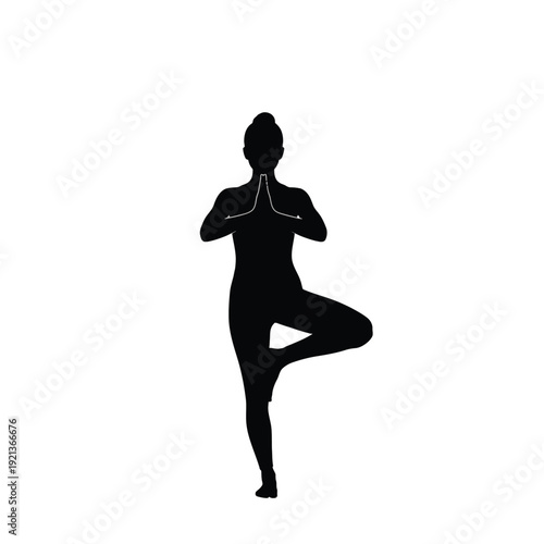 Serene woman in yoga tree pose for mindfulness and balance