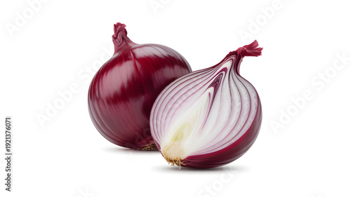 Two red onions, one whole and one halved, on a white background