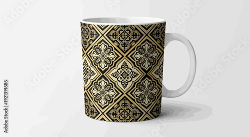 A white coffee mug with a gold and black geometric pattern on a white surface viewed from the side