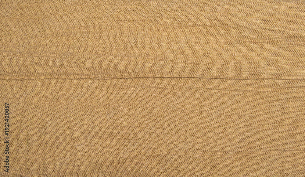 Fototapeta premium Elegant Brown Fabric Surface with Gentle Creases - Linen Wrinkle Texture Background