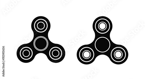 Two black fidget spinners displayed against a white background silhouette