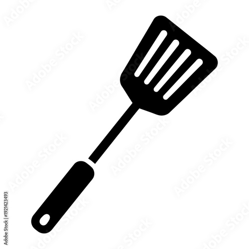 A black and white image of a spatula