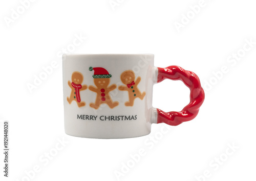 A festive mug with the words Merry Christmas and a gingerbread print with a red twisted handle on a white background 