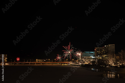 Colorful fireworks in the night sky. Celebration of new year and diwali with moon in the sky. copyspace.