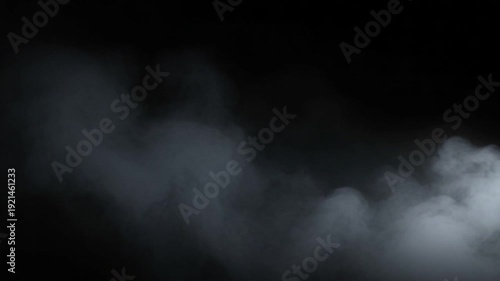 Drifting Smoke or Fog Effect Against Black Backdrop Slow Motion