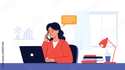 Professional woman working from home on a laptop while talking on her smartphone at a desk with books and a lamp nearby.