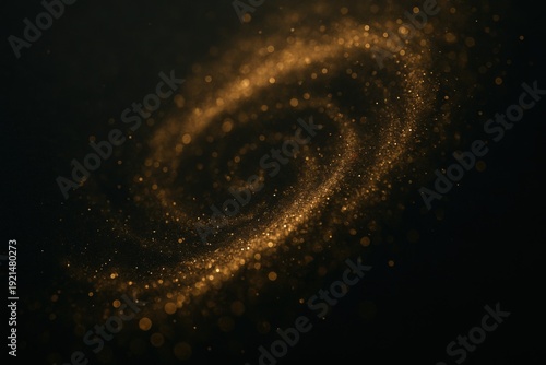 Swirling golden particles create a pattern resembling a galaxy on a dark background during an artistic display