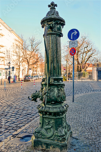 Historic water pump in the old town district of Rixdorf in Berlin.