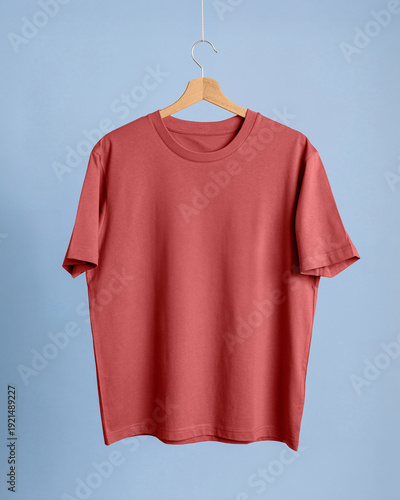 Quadro em tela Cotton t-shirt mockup crimson red coral wooden hanger cerulean blue background t