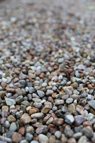 Pebbles or decorative gravel, naturally rounded stones that are often used for gardening and landscaping, the surface is smooth and the stones are mixed in different colors