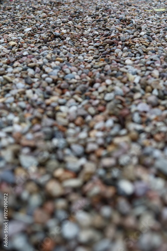 Pebbles or decorative gravel, naturally rounded stones that are often used for gardening and landscaping, the surface is smooth and the stones are mixed in different colors