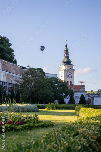 Framed view of the Mikulov town hall tower with clock and green roof