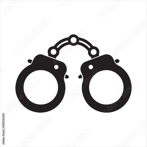 A simple black and white illustration depicts a pair of open handcuffs symbolizing freedom