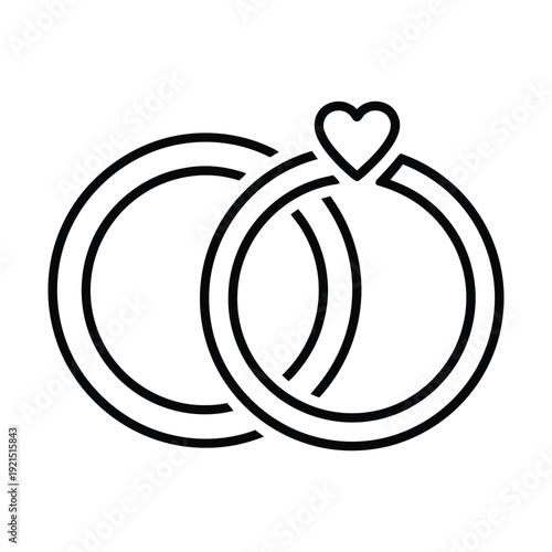 Two intertwined wedding rings with a small heart accent symbolize eternal love and commitment for a ceremony design.