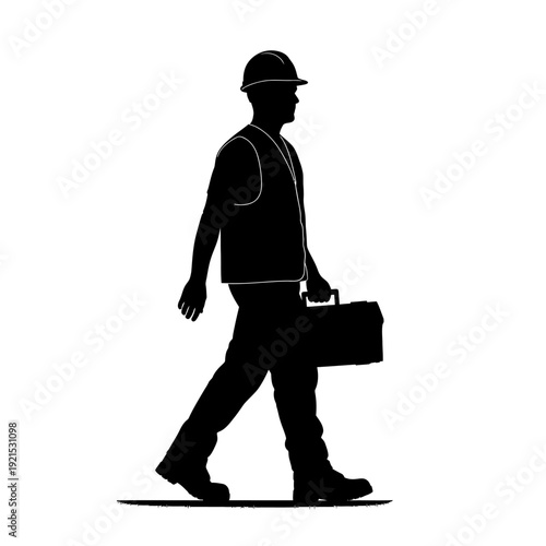 Silhouette of a Construction Worker Walking with a Toolbox.