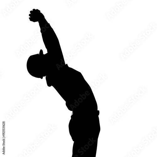 Silhouette of a man stretching his back and arms upwards.