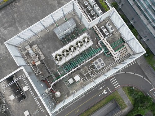 Принти на полотні Aerial top-down view of complex cooling towers and piping for an AI data center
