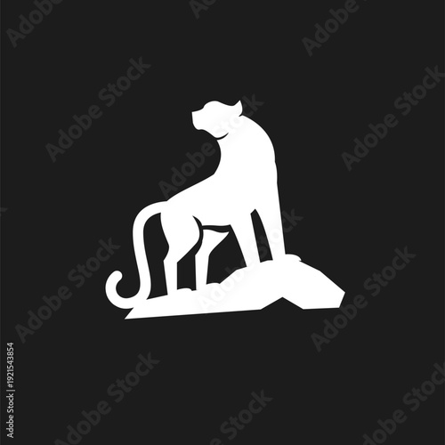 White silhouette of a majestic big cat, like a lioness or puma, perched on a rock
