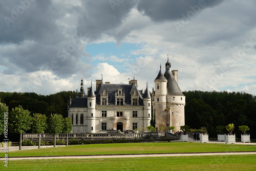 Scenic view of the Château de Chenonceau spanning the River Cher. Iconic French Renaissance architecture with elegant arches, historic galleries, and landscaped surroundings in the Loire Valley