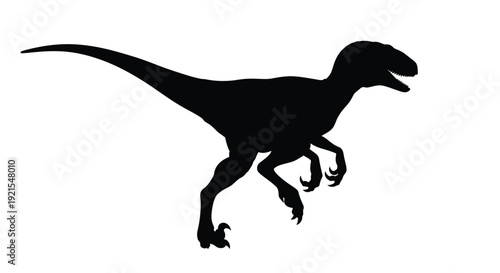 Silhouette of a velociraptor in a dynamic hunting pose