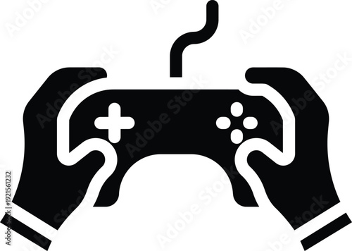 Silhouette of hands holding gaming controller with wired connection for competitive video game play experience