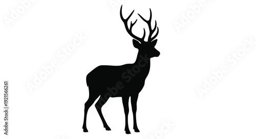 Silhouette of a majestic stag with large branching antlers shown in profile