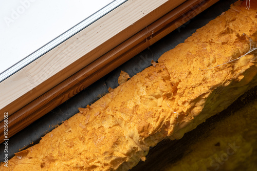 Photos Detail of roof window frame with expanding foam insulation