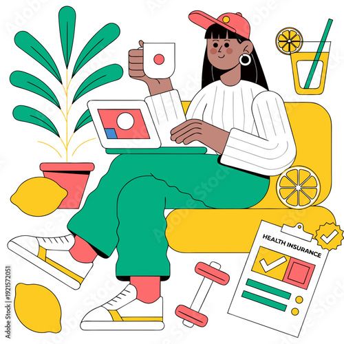 A woman sits on a yellow couch with a laptop and coffee