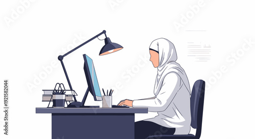 woman wearing hijab working on computer.
