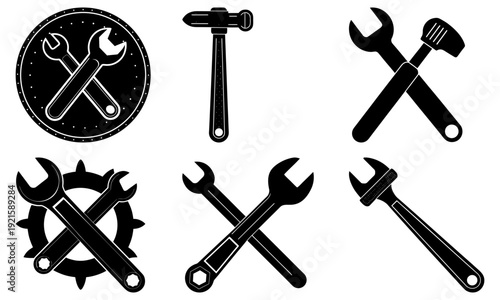 Collection of wrenches, hammers, and spanners arranged neatly, showcasing various tools for industrial and mechanical tasks