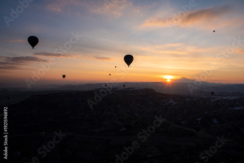 Wallpaper Mural Panoramic landscape view at sunrise with mountains and hot air balloons silhouette flying in sky Torontodigital.ca
