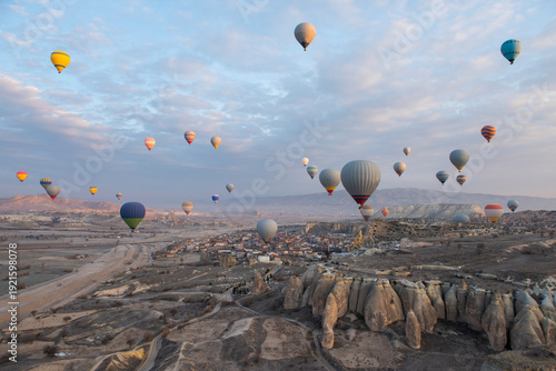 Wallpaper Mural Panoramic landscape view across Cappadocia region valley with fairy chimneys and hot air balloons flying in sky Torontodigital.ca