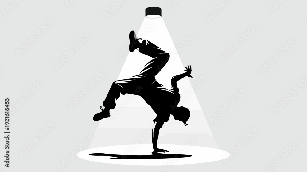 Fototapeta premium Breakdance Silhouette: A dynamic silhouette captures a breakdancer in motion, balancing on one hand under a spotlight, showcasing energy and athleticism.
