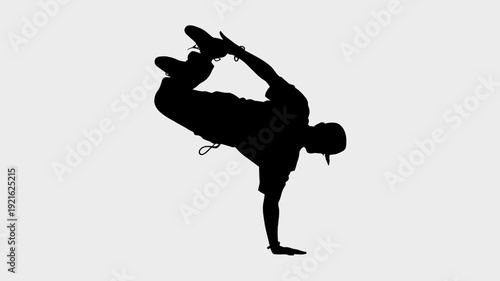 Dynamic Silhouette: A dynamic silhouette of a breakdancer in motion, showcasing the athleticism, precision, and artistry of the dance form, set against a clean background.