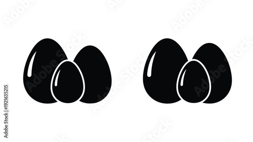 Two pairs of black glossy teardrop shapes on a white background