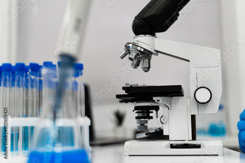 Wallpaper Mural Medical researcher using microscope in modern laboratory exploring AI assisted diagnostics precision medicine approach focused early detection personalized treatment data driven healthcare innovation Torontodigital.ca