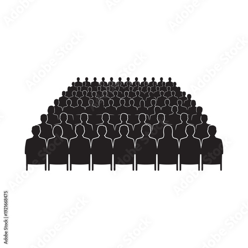 A large crowd of silhouetted people seated in rows facing forward