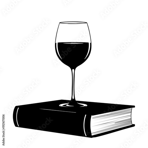 A glass of wine sitting atop a book, illustrating the enjoyment of literature and leisure