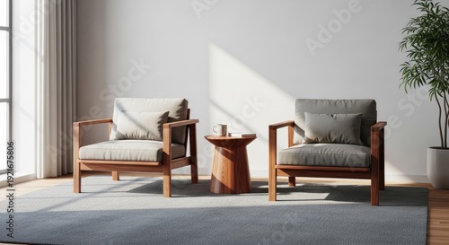 Modern living room with two armchairs and a small table bathed in sunlight