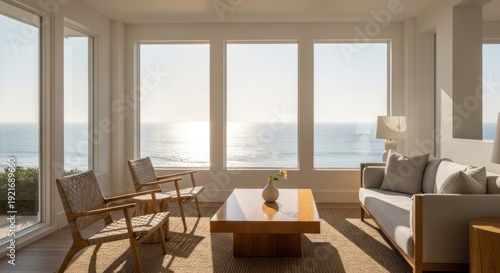 Bright living room with large windows overlooking ocean view on sunny day