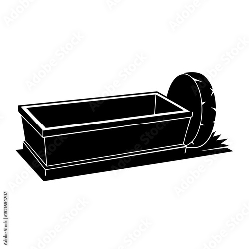 An ancient well or trough, carved into the stone with a wheel attached