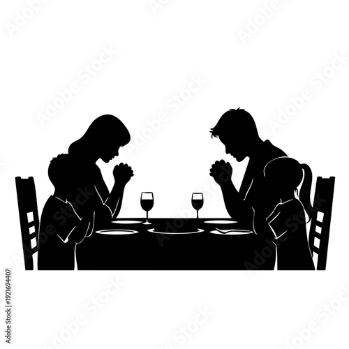 Family silhouette praying before dinner at dining table. The scene portrays unity and reflection