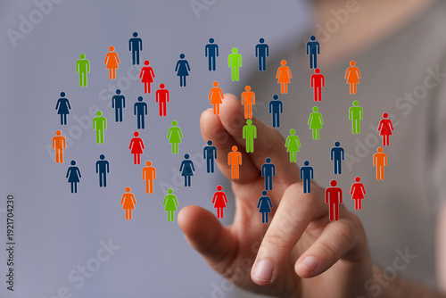 Hand touching colorful figu...