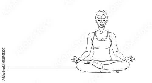 Woman practicing yoga in lotus position with serene expression.