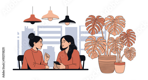 Two women sitting at a table with a phone having a conversation in a cozy room filled with large green monstera houseplants.