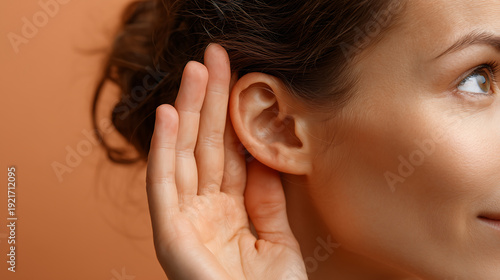 Close up of a Woman Cuping Her Ear to Listen